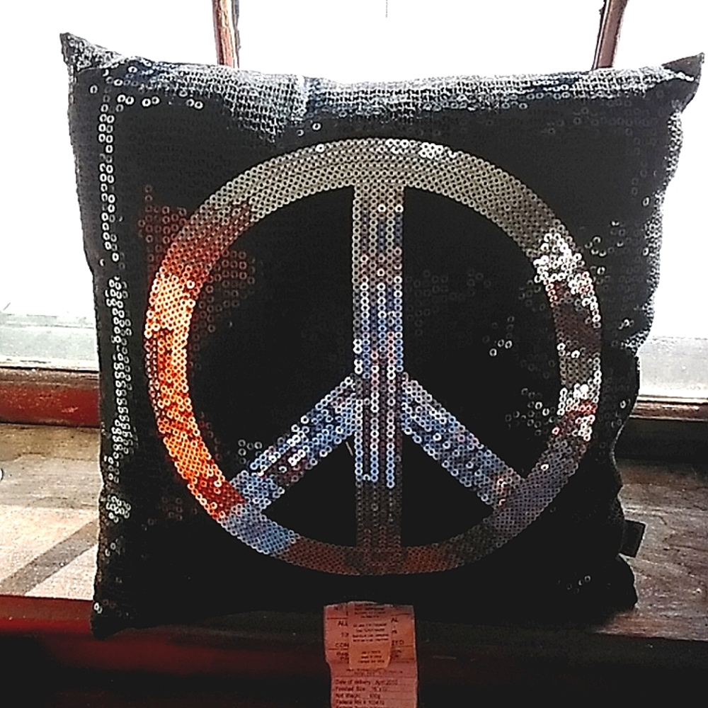 A pillow with the peace sign